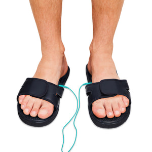Chaussons TESMED SLIPPERS pour la stimulation des pieds, à utiliser en combinaison avec un appareil TESMED. Pendant le traitement, un agréable massage est ressenti du pied jusqu'au genou
